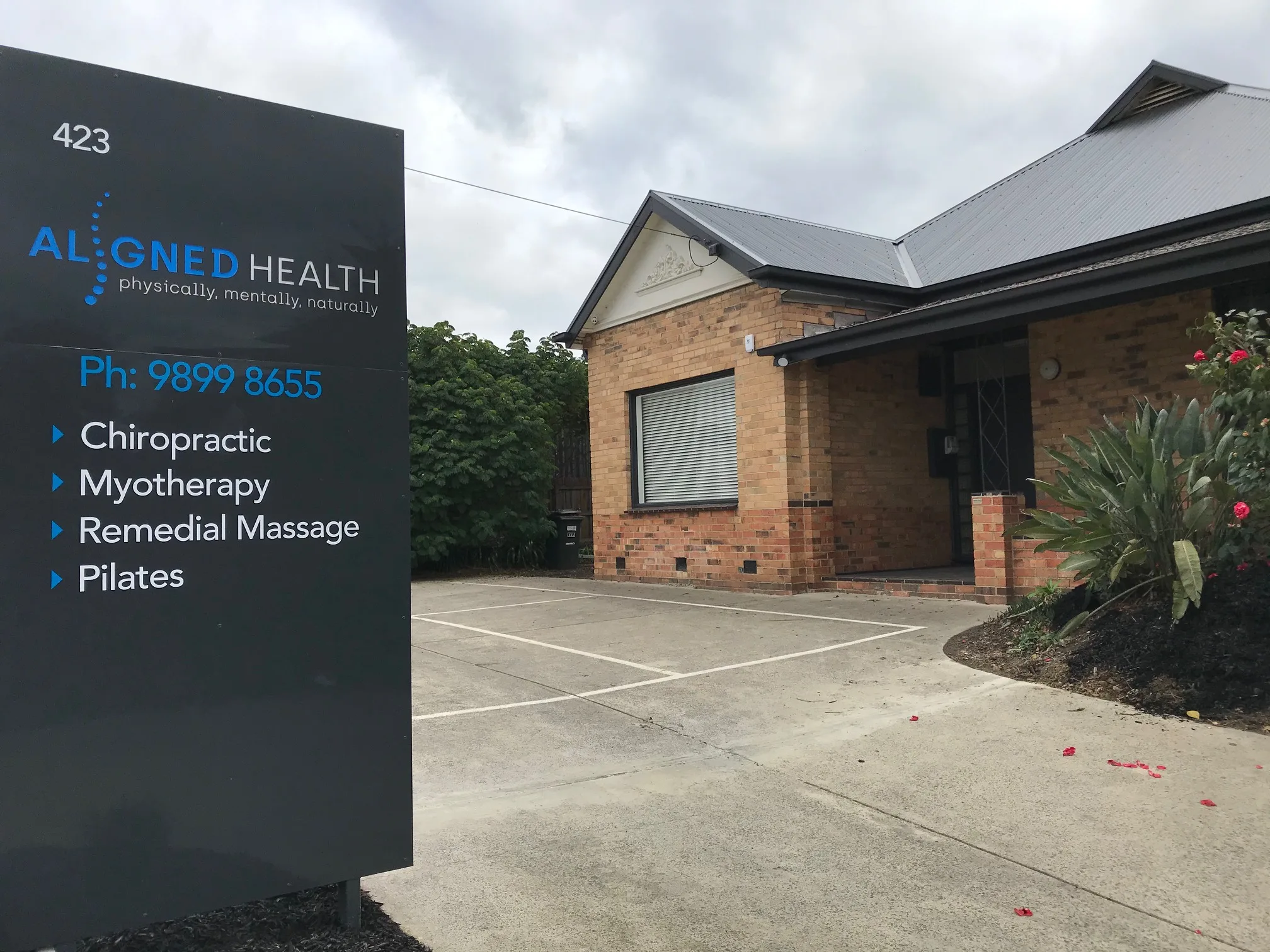 Aligned Health exterior at 423 Station St Box Hill — monolith practice sign listing services and phone number